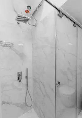 a bathroom with a shower with a glass door at Luxury Studio in the heart of Kolonaki in Athens