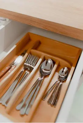 a drawer with silver utensils on a wooden tray at Luxury Studio in the heart of Kolonaki in Athens