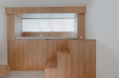 a room with a window and a wooden wall at Luxury Studio in the heart of Kolonaki in Athens