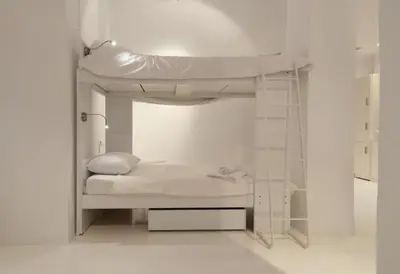 a bedroom with a bunk bed in a white room at Athens Soho Lofts - Super 8 in Athens