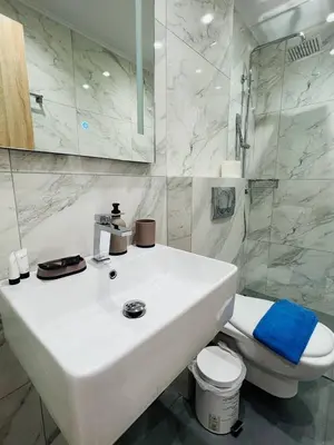 a white bathroom with a sink and a toilet at Cozy Corner Dialog Number 2 VIPGreece in Athens