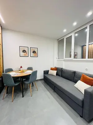 a living room with a couch and a table at Cozy Corner Dialog Number 2 VIPGreece in Athens