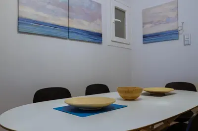 a white table with two bowls on top of it at Adorable 2 bedroom apartment close to Ancient Athens city center in Athens