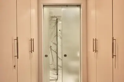 a bathroom with a shower and a glass door at Athenian Elite Kolonaki Apt in Athens