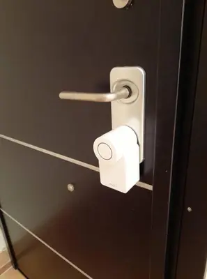 a toilet paper dispenser with a roll of toilet paper at Casa Nova - Appartment near the sea in Piraeus