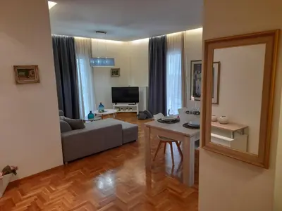 a living room with a couch and a table at Casa Nova - Appartment near the sea in Piraeus