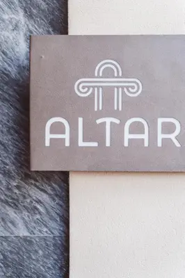 a sign for an airplane on a wall at Altar Suites in Athens