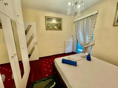 a room with a bed and a window at Flisvos Elite Seafront Luxury Apartment in Athens