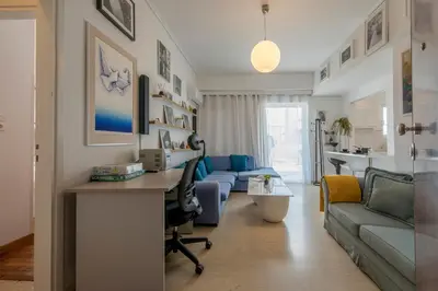 a living room with a desk and a couch at Maria Louiza apartment close to the center in Athens