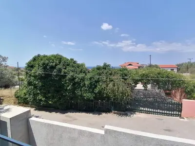 a fence in front of a yard with trees at Greek Dream Homes Thimari in Sounio