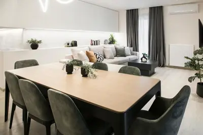a living room with a table and a couch at Ultra Chic Modern 4 Bedrooms Apartment in Athens in Athens
