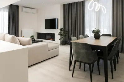 a living room with a table and a couch at Ultra Chic Modern 4 Bedrooms Apartment in Athens in Athens