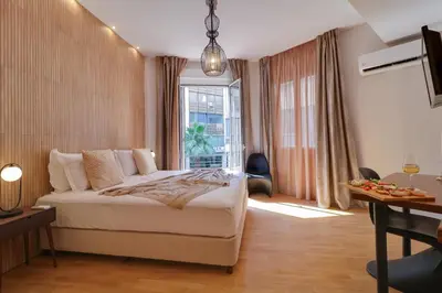 a hotel room with a bed and a window at AthINN Residence in Athens