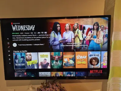 a flat screen tv hanging on a wall at Semelia's Guest house in Spáta