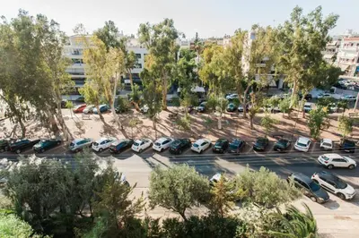 an aerial view of a parking lot with cars parked at 2BDR Athens Riviera Sea View Apartment by The Olon in Athens