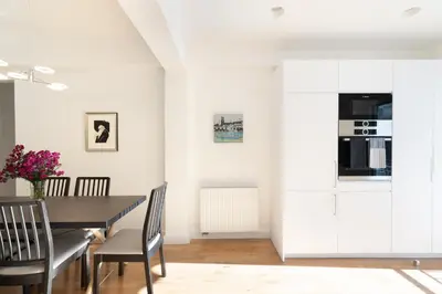 a dining room with a table and chairs at Wonderful Central Athens 2 Bedroom 2 Bath Sleeps 8 in Athens