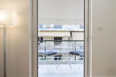 a sliding glass door with a view of a balcony at Wonderful Central Athens 2 Bedroom 2 Bath Sleeps 8 in Athens
