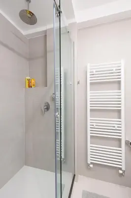 a shower with a glass door in a bathroom at Wonderful Central Athens 2 Bedroom 2 Bath Sleeps 8 in Athens
