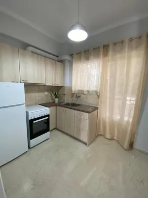 a kitchen with a white refrigerator and a stove at Christy's House Anavissos / Ανάβυσσος in Anavissos