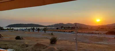 a view of the sunset from a building at Christy's House Anavissos / Ανάβυσσος in Anavissos