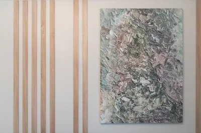 two pieces of art hanging on a wall at MEDLUXE COMFORT APARTMENT in Athens