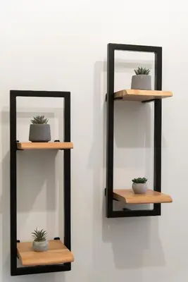 a shelf with two mirrors and a plant on it at MEDLUXE COMFORT APARTMENT in Athens