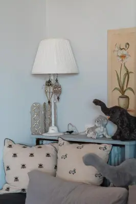 a living room with a couch and a table with a lamp at Ioanna's Hellenic Hospitality in Athens