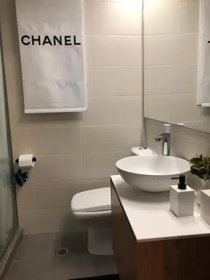 a bathroom with a sink and a toilet and a mirror at The excellent home in Athens