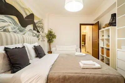 a bedroom with two beds with towels on them at The excellent home in Athens
