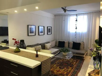 a living room with a couch and a table at The excellent home in Athens