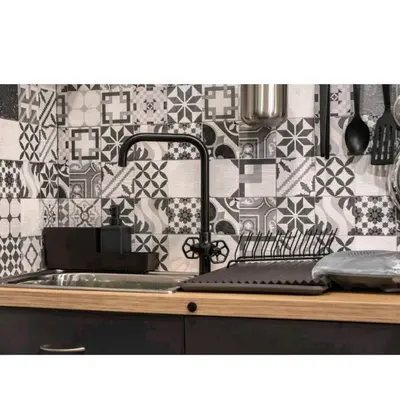 a kitchen with a sink and a tile wall at Alley's house Athens in Athens