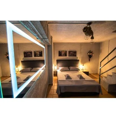 a bedroom with two beds and a window at Alley's house Athens in Athens