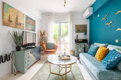 a living room with a couch and a table at Athens Escape in Athens
