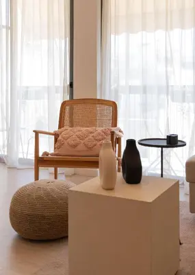 a living room with a chair and a table at Charitos Heights Boutique Apt II, Kolonaki in Athens