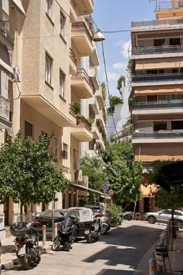 a row of motorcycles parked next to a building at Charitos Heights Boutique Apt II, Kolonaki in Athens