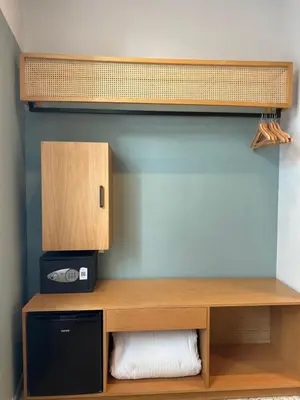 a wooden shelf with a microwave in a room at Belle Athenes - Luxury Rooms at Monastiraki Railway Station in Athens
