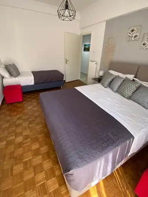 a bedroom with a large bed in a room at Athens Sunnyside condo in Athens