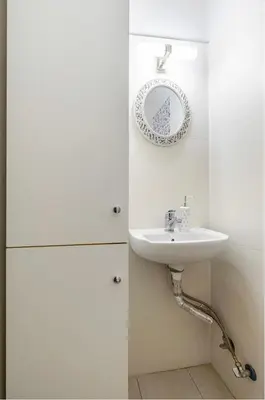 a bathroom with a sink and a plate on the wall at Urban grey in Athens