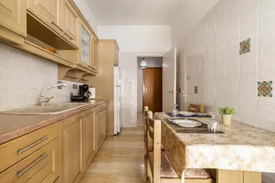 a kitchen with a sink and a counter top at Urban grey in Athens