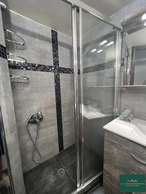 a bathroom with a shower and a sink at Thiseio Residence 58 in Athens