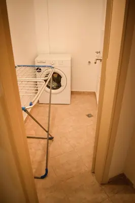 a washer and dryer sitting in a laundry room at Όμορφο διαμέρισμα στην περιοχή της Ηλιούπολης in Athens