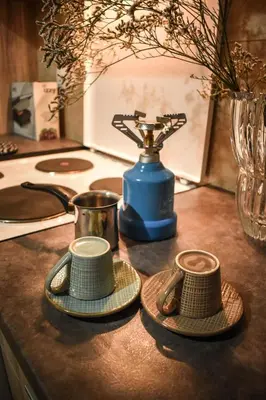 two hats are sitting on a counter with a blender at Όμορφο διαμέρισμα στην περιοχή της Ηλιούπολης in Athens