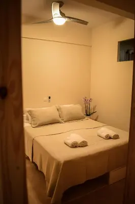 a bedroom with a bed with two towels on it at Όμορφο διαμέρισμα στην περιοχή της Ηλιούπολης in Athens