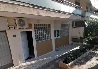 an outside view of a building with a door at Όμορφο διαμέρισμα στην περιοχή της Ηλιούπολης in Athens
