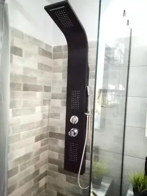 a shower with a glass door with a shower head at Hesperides Garden in Athens