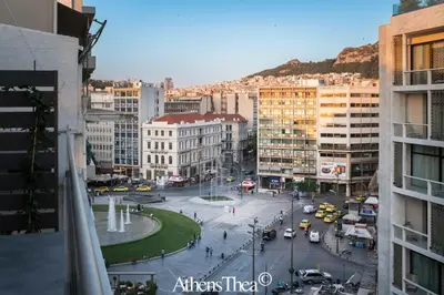a view of a city with traffic and buildings at AthensThea Alpha Luxury Penthouse Apt in Omonia in Athens