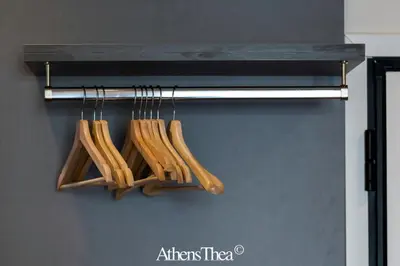 a bunch of wooden utensils hanging on a rack at AthensThea Alpha Luxury Penthouse Apt in Omonia in Athens