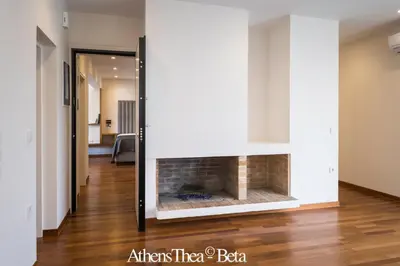 a fireplace in the living room of a house at AthensThea Beta Luxury Penthouse Apt in Omonia in Athens