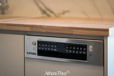a microwave oven with a wooden counter top on top at AthensThea Beta Luxury Penthouse Apt in Omonia in Athens