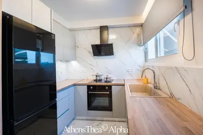 a kitchen with a sink and a stove top oven at AthensThea Luxury Penthouse Apt in Omonia 115sq.m. in Athens